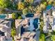 Aerial view of a luxurious property with a large pool and manicured landscaping at 10308 Rocky Mesa Ct, Las Vegas, NV 89144