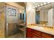 Elegant bathroom with a walk-in shower and modern vanity at 10308 Rocky Mesa Ct, Las Vegas, NV 89144