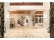 Elegant two story foyer with a marble floor and a sweeping staircase at 10308 Rocky Mesa Ct, Las Vegas, NV 89144