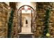 Grand entry with ornate iron doors and stone accents at 10308 Rocky Mesa Ct, Las Vegas, NV 89144