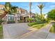 Stunning two-story home with a large driveway and lush landscaping at 10308 Rocky Mesa Ct, Las Vegas, NV 89144