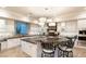 Elegant kitchen boasts a large island, granite countertops, and breakfast bar at 10308 Rocky Mesa Ct, Las Vegas, NV 89144