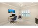 Home office with desk, chair, and large window at 10308 Rocky Mesa Ct, Las Vegas, NV 89144