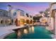 Resort-style backyard oasis featuring a large pool and fire pit at 10308 Rocky Mesa Ct, Las Vegas, NV 89144