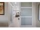 Elegant bathroom with double vanity, soaking tub, and a barn door at 1221 Olivia Pkwy, Henderson, NV 89011