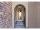 Open entryway with wood door and tile flooring at 1221 Olivia Pkwy, Henderson, NV 89011