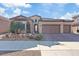 Single story home with a 3 car garage and desert landscaping at 1221 Olivia Pkwy, Henderson, NV 89011