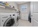 Laundry room with washer, dryer, and utility sink at 1221 Olivia Pkwy, Henderson, NV 89011