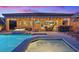 Luxury pool and spa with fire pit and seating at 1221 Olivia Pkwy, Henderson, NV 89011