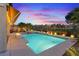 Expansive pool and spa at sunset; golf course view at 1221 Olivia Pkwy, Henderson, NV 89011