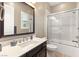 Clean bathroom with a shower/tub combo, vanity, and large mirror at 12456 Edinburgh Cask Ave, Las Vegas, NV 89138