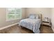 Charming bedroom with a full-size bed and ample natural light at 12456 Edinburgh Cask Ave, Las Vegas, NV 89138