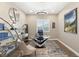 Bright home office with a large desk, comfortable chair, and built-in shelving at 12456 Edinburgh Cask Ave, Las Vegas, NV 89138