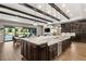 Large kitchen island with breakfast bar and high-end stainless steel appliances at 12456 Edinburgh Cask Ave, Las Vegas, NV 89138