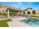 Relaxing backyard with a covered patio, pool, and spa at 12456 Edinburgh Cask Ave, Las Vegas, NV 89138