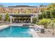 Stunning pool with a spa and cascading waterfall feature at 12456 Edinburgh Cask Ave, Las Vegas, NV 89138