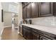 Custom wet bar with wine cooler and ample storage at 12456 Edinburgh Cask Ave, Las Vegas, NV 89138