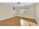 Well-lit bedroom featuring hardwood floors and window at 1326 Summer Dawn Ave, Henderson, NV 89014