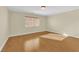 Spacious bedroom with hardwood floors and window at 1326 Summer Dawn Ave, Henderson, NV 89014