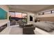 Main bedroom with fireplace, sitting area, and sliding glass doors leading to a patio at 1485 Placid Coast Ct, Henderson, NV 89011