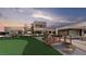 Modern home exterior with putting green and bridge at 1488 Placid Coast Ct, Henderson, NV 89011