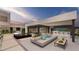 Relaxing patio with pool, bar, and lounge area at 1488 Placid Coast Ct, Henderson, NV 89011