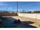 Large backyard with wooden fence and mountain views at 1924 Hart Ave, North Las Vegas, NV 89032