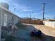 Backyard view of house with wooden fence at 1924 Hart Ave, North Las Vegas, NV 89032