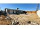 Large backyard with a wooden fence at 1924 Hart Ave, North Las Vegas, NV 89032