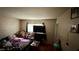 Small bedroom with a double bed and a TV at 1924 Hart Ave, North Las Vegas, NV 89032