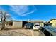 House exterior with driveway and two parked cars at 1924 Hart Ave, North Las Vegas, NV 89032