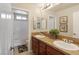 Double vanity bathroom with updated fixtures and tile flooring at 1932 Barrow Glen Ct, North Las Vegas, NV 89084