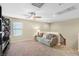 Bright bonus room with large window and ceiling fan at 1932 Barrow Glen Ct, North Las Vegas, NV 89084