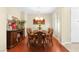 Formal dining room with hardwood floors and elegant furniture at 1932 Barrow Glen Ct, North Las Vegas, NV 89084