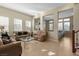 Spacious living room with two sofas and a large window at 1932 Barrow Glen Ct, North Las Vegas, NV 89084