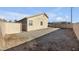 Large backyard with gravel and a wooden fence at 2005 Ona Marie Ave, North Las Vegas, NV 89032