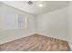 Bright bedroom with wood-look flooring and neutral wall colors at 2005 Ona Marie Ave, North Las Vegas, NV 89032