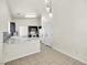 Bright dining area adjacent to kitchen with pendant lighting at 2005 Ona Marie Ave, North Las Vegas, NV 89032