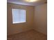 Small bedroom with tile floors and window at 2108 Buckeye Reef St, Henderson, NV 89002