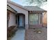 Inviting front entrance with a covered entryway and large windows at 2108 Buckeye Reef St, Henderson, NV 89002