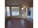 Bright living room with tile floors and large windows at 2108 Buckeye Reef St, Henderson, NV 89002