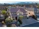 Two-story house with a three-car garage, pool, and mountain views at 3115 Azure Bay St, Las Vegas, NV 89117