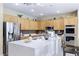 Kitchen with an island, stainless steel appliances, and wood cabinets at 3115 Azure Bay St, Las Vegas, NV 89117