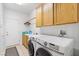 Laundry room with washer, dryer, and cabinets at 3115 Azure Bay St, Las Vegas, NV 89117