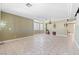 Spacious living room with tile floors and a chandelier at 3115 Azure Bay St, Las Vegas, NV 89117