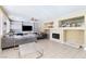 Bright living room with fireplace and built-in shelving at 3115 Azure Bay St, Las Vegas, NV 89117