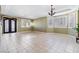 Bright living room with tile floors and large windows at 3115 Azure Bay St, Las Vegas, NV 89117