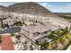 Aerial view of a two-story house with a large backyard and mountain views at 3267 Royal Fortune Dr, Las Vegas, NV 89141