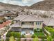 Aerial view of house, two-story home with balcony and backyard patio at 3267 Royal Fortune Dr, Las Vegas, NV 89141