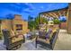 Outdoor patio with fire pit and seating at 3267 Royal Fortune Dr, Las Vegas, NV 89141